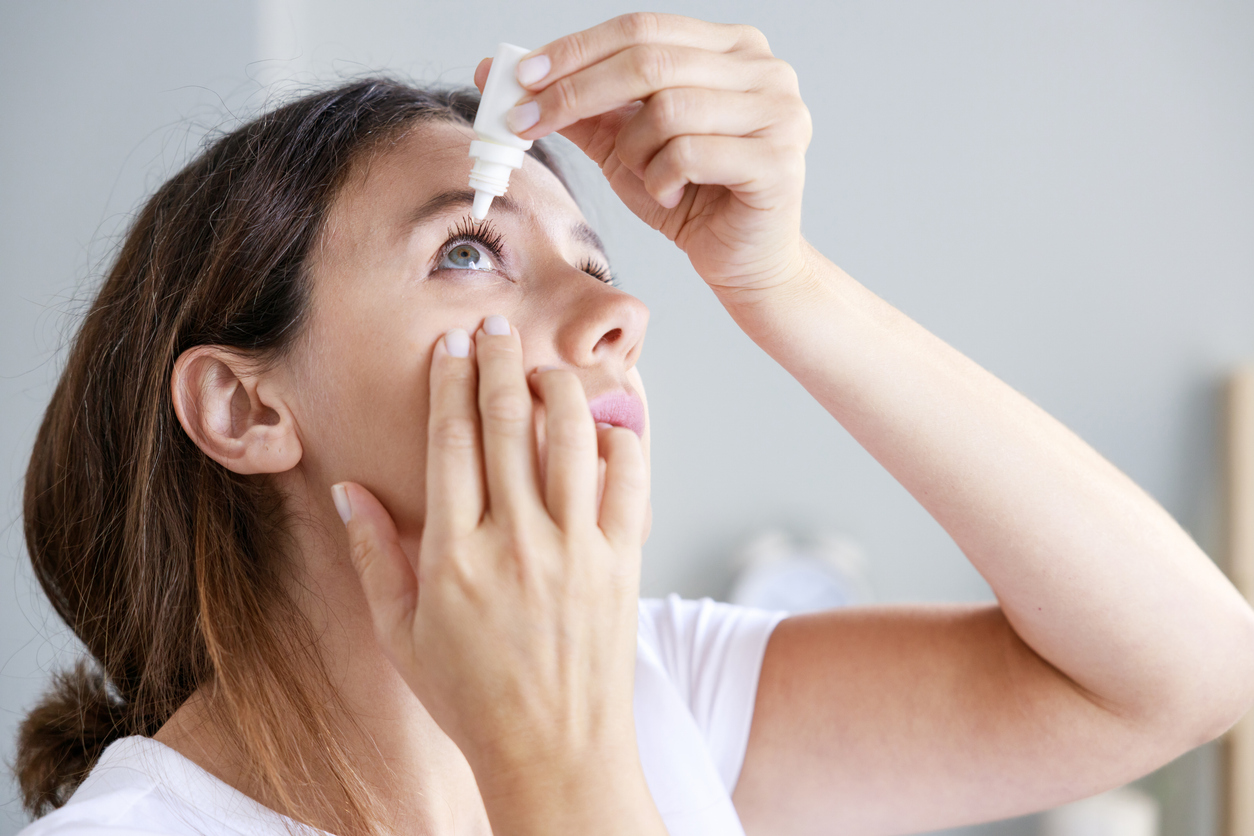 Woman Putting in Eye Drops